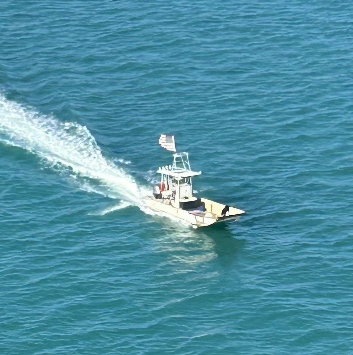 Keys Watermen delivery boat cruising through the blue waters of Key West